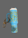 A blue dragon fly tumbler key chain it hold loose change or chapstick 