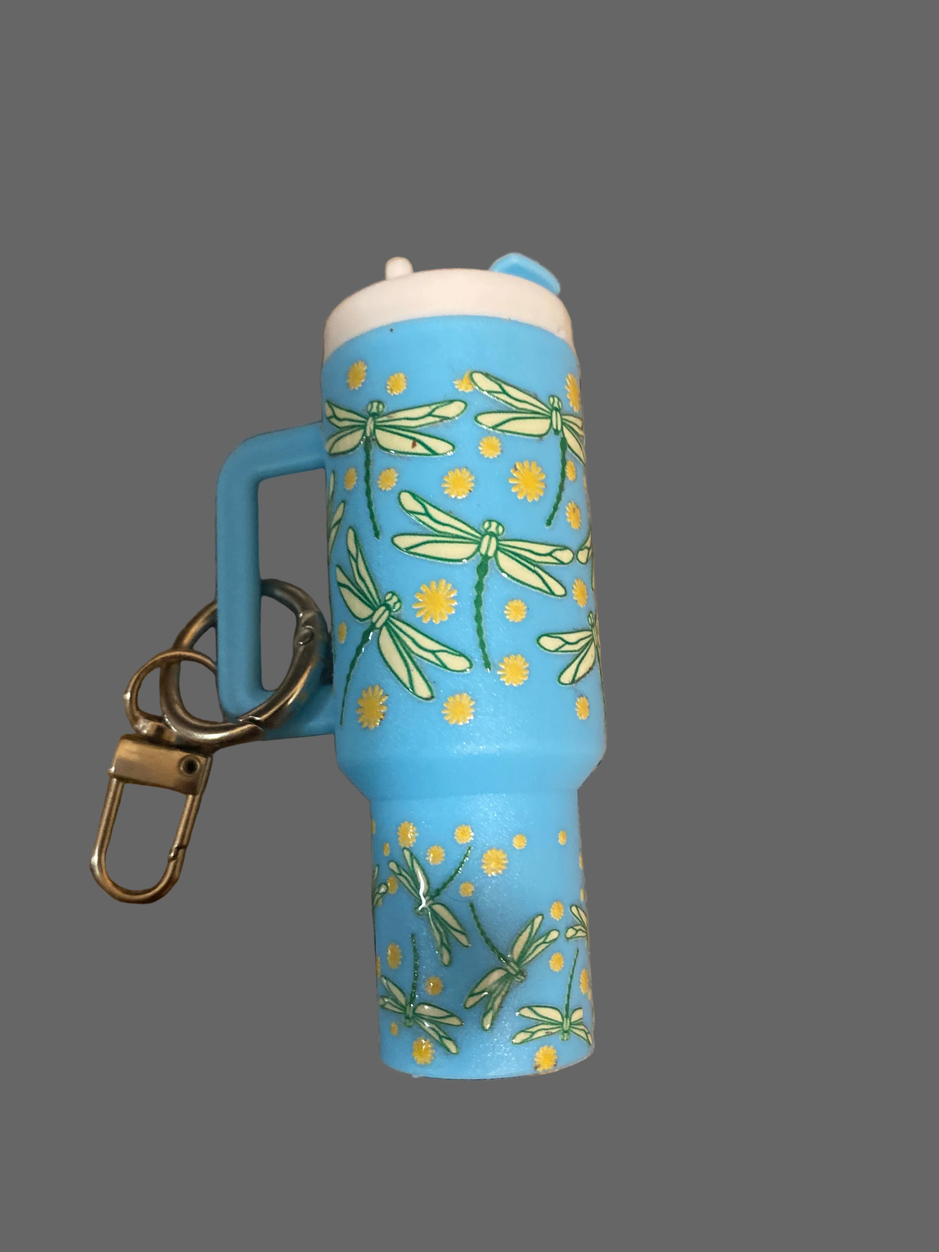 A blue dragon fly tumbler key chain it hold loose change or chapstick 